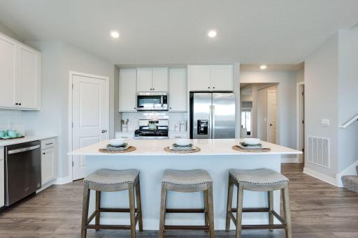 A kitchen view sure to impress guests and serve as a great heart of the home. Photo of model home, colors will vary.