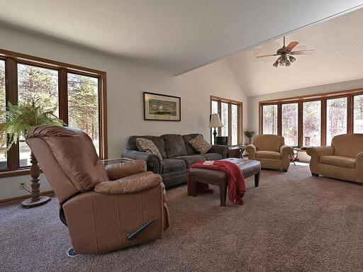 Vaulted ceilings in the living room with large bay window.