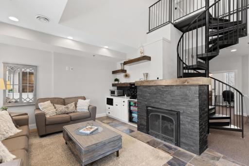 Comfortable seating next to the built-in kitchenette & cozy fireplace