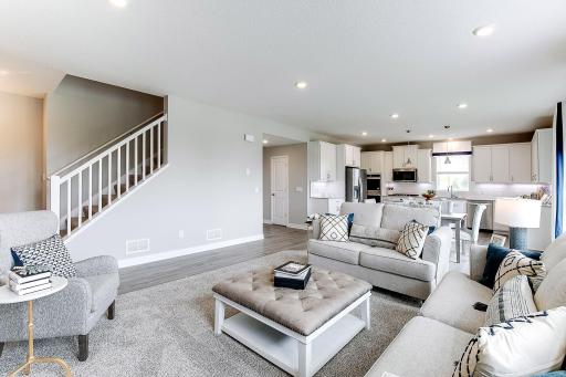 Cozy family room just off of the dinette making the main level open and spacious. *photo of a model home, selections and finish will vary.