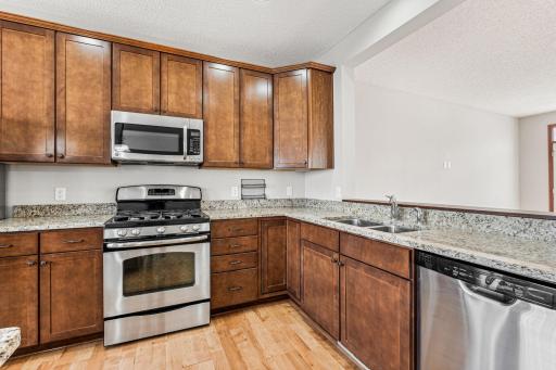 High quality cabinets, granite countertops, and stainless steel appliances