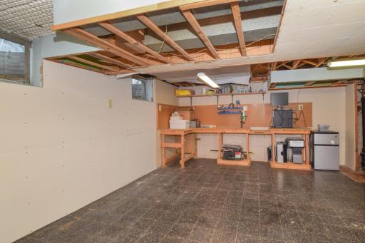 Unfinished Basement with built-in workbench