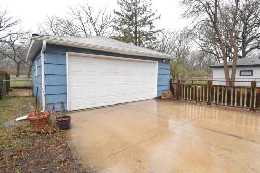 Double garage is just steps away from the house. Concrete driveway.
