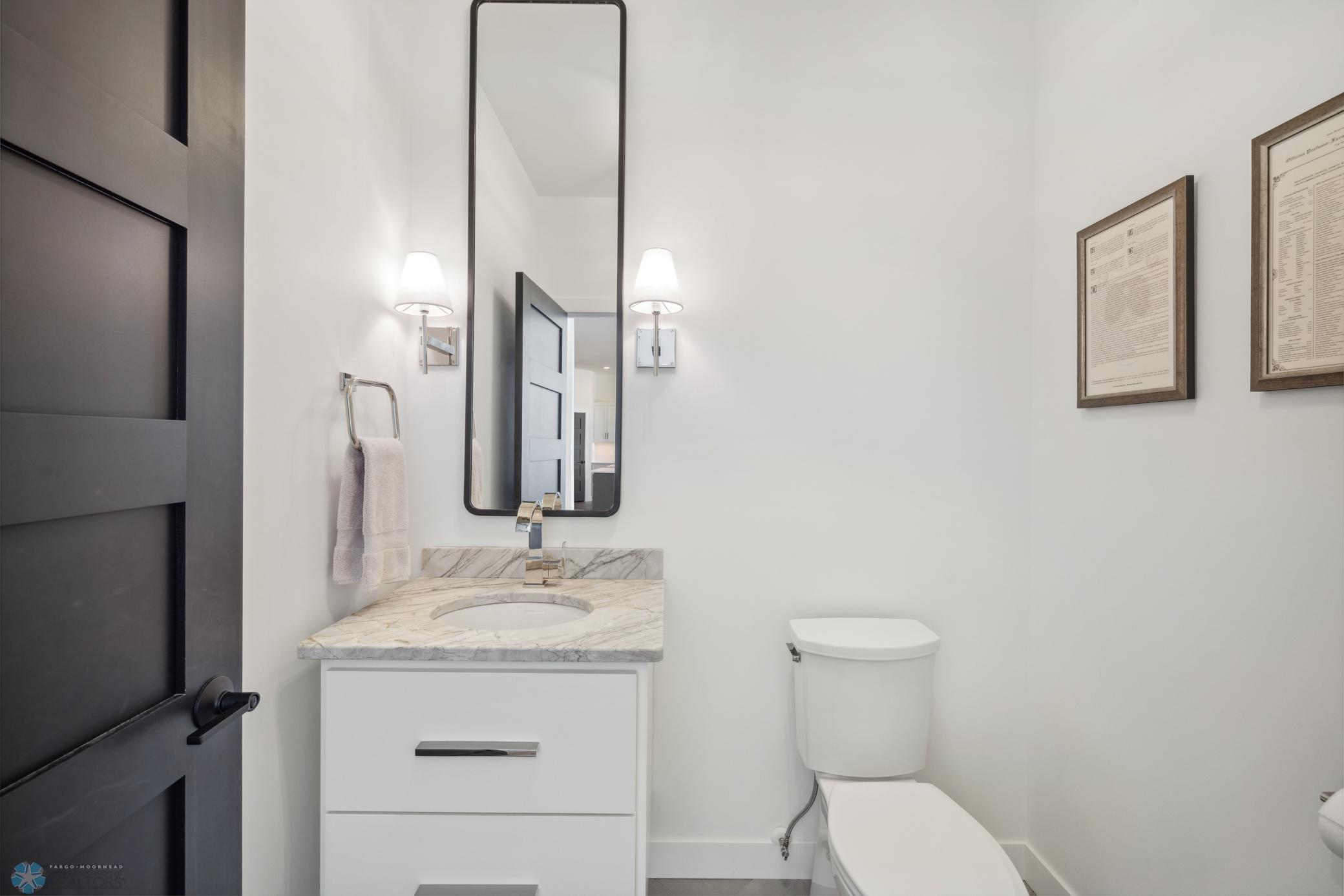 Half Bathroom on Main Level for Guests Natural Stone Counters