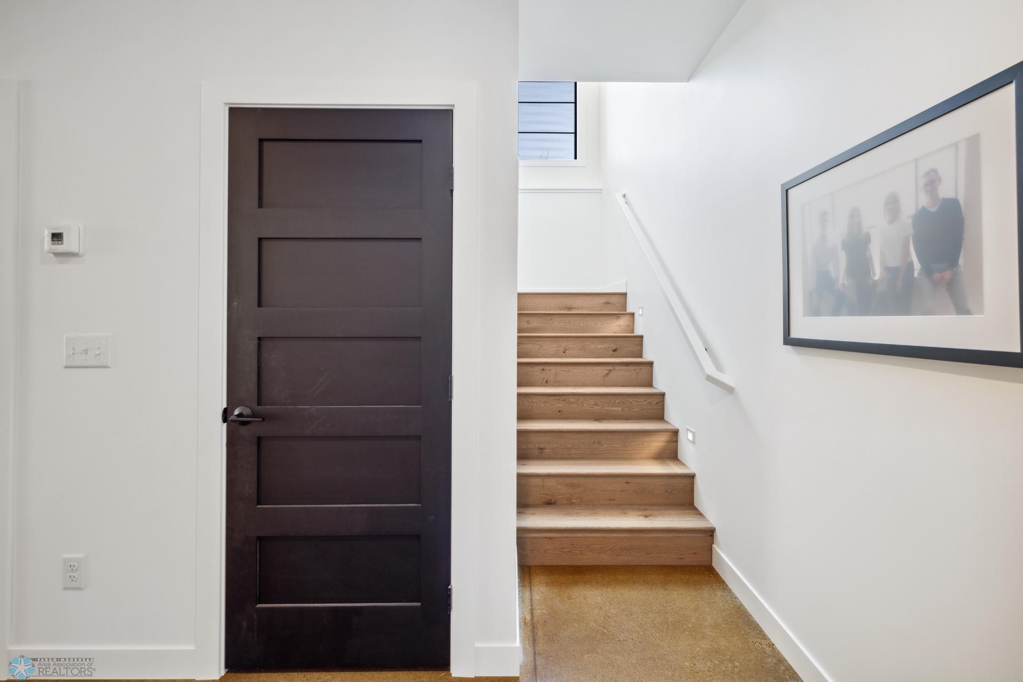 Stairway To Basement & Storage Room