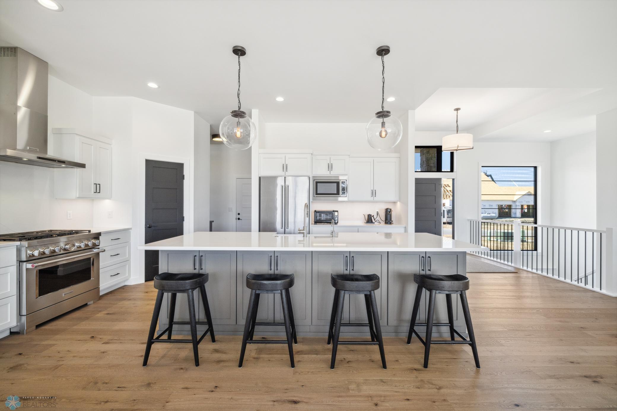 Kitchen Island Quartz Counters & Full Height Quartz Backsplash
