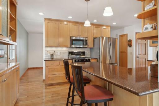 Island seating & stainless steel appliances