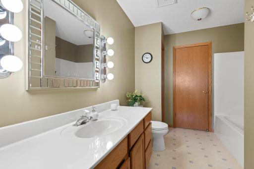 Convenient tub/shower combo, a spacious walk-in closet, and exclusive entry to the laundry room for added convenience.