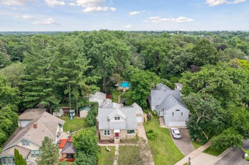 1470 Victoria Street North: Aerial view showing the unusually large (.54 ACRE LOT) for Como Park. The lot encompasses a private wooded backyard with pool, deck and patio for outdoor entertaining and winding trails through the ravine!