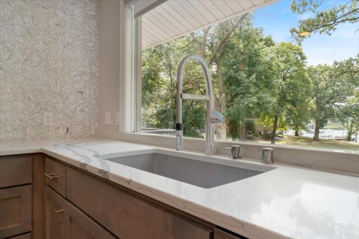 Wash dishes in the large, deep ceramic sink as you watch the serene activities of lake life!