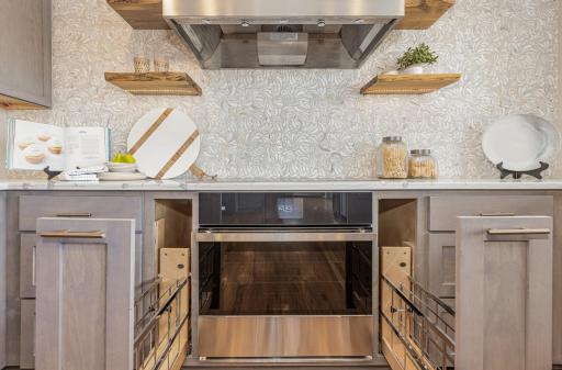 Pull-out drawers on each side of the stove are the perfect size for cooking pans and lids!