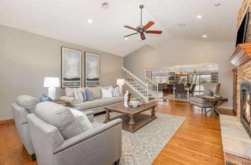 Stairs in the main floor living room lead up to second level where a den, two bedrooms and a bathroom are located.