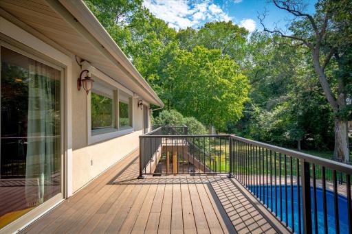 Maintenance-free composite deck right off the kitchen and primary bedroom on the back side of the home to extend those living spaces to the great outdoors of your lakeshore!