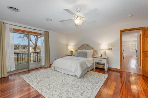 The main floor primary bedroom has a private balcony overlooking the lake, which is a perfect location to ease into your morning with a relaxing cup of coffee.