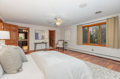 Primary bedroom has private door into large primary bathroom.
