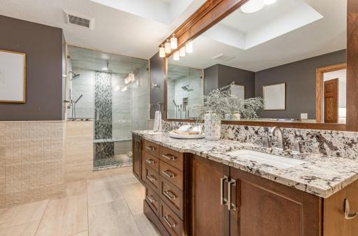 The primary bedroom has a spacious primary spa-like bathroom.