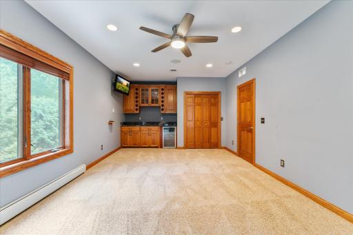 The original owners created this upper-level area as a rec room with a pool table. This would also be a good bedroom for in-laws because of the kitchenette area.