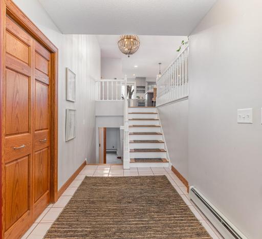 Front entry to this multi-level home has a roomy coat closet and access door to the garage.