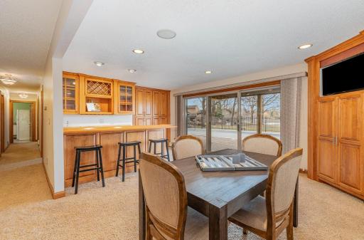 Lower-level has a spacious area for entertaining and a table and bar that seat 7 people.