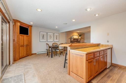A custom cabinet for storage and a TV will allow you to watch a game while entertaining!