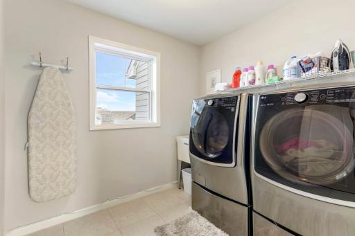 Convenient upper level laundry with high end Samsung washer and dryer.