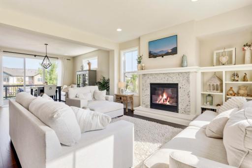 Welcoming family room with granite surround and beautiful built ins.