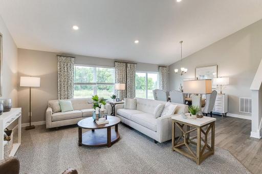 Open concept living. Our smart home package is included in every home. Photo is of model home. Colors and options may vary. Ask Sales Agent for details.