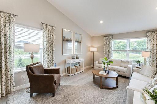 Beautiful living space with lots of windows bring in lots of natural light. Photo is of model home. Colors and options may vary. Ask Sales Agent for details.