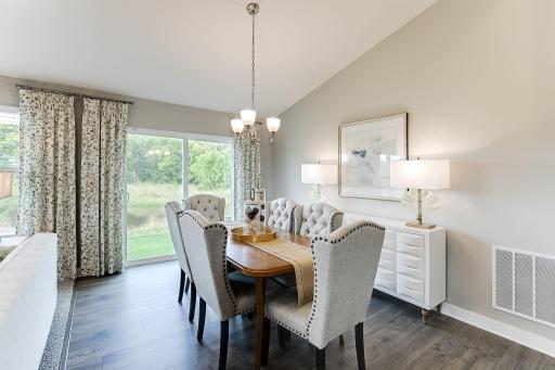 Dining room on the main level, this informal space is large enough to accommodate just about any dining room table configuration! Photo is of model home. Colors and options may vary. Ask Sales Agent for details.