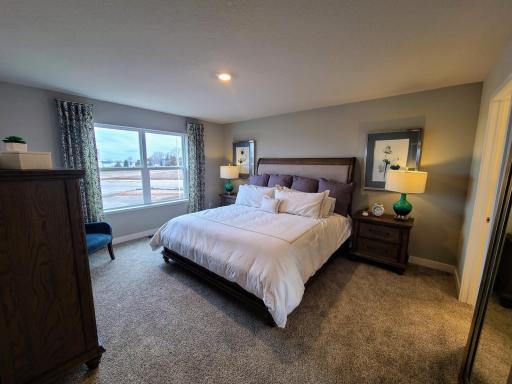 Owner's suite is large enough for a King bed and more. Photo is of model home. Colors and options may vary. Ask Sales Agent for details.