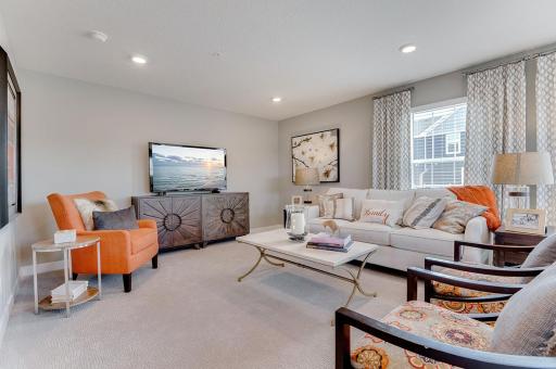 Spacious living room makes entertaining a breeze! Model home, details will vary.