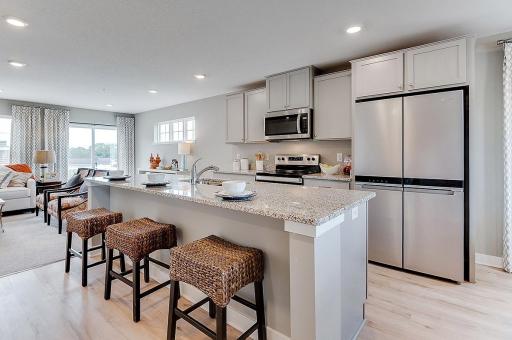 The centerpiece of this home is the beautifully appointed kitchen and 9-foot center island! Model home, details will vary.