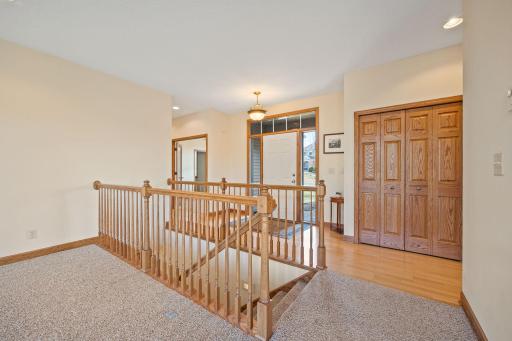 The foyer is part of the sunlight filled great room, with a large closet nearby. This home has so much storage on all levels. Oak woodwork and raised panel doors show the quality of the home.