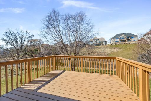 Nicely maintained deck with views of the yard and retention pond, which brings in wildlife. The landscaping is just starting to come alive.