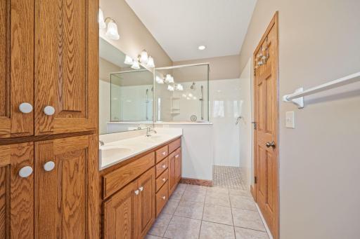 Beautiful, large 3/4 private owner's bathroom with dual sinks, walk-in shower, and tile flooring.