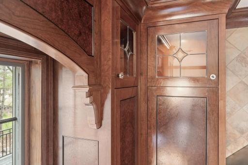 An example of the custom black walnut book-matched burl wood veneer cabinetry.