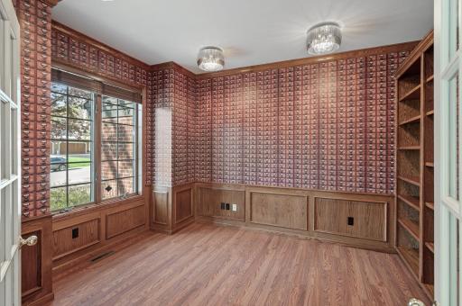 Remember the Dewey Decimal system? The card catalogue wallpaper is a creative complement to the custom oak panels.