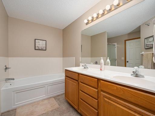 Master bath has a double sink vanity and a really desirable jacuzzi bath. The separate shower is in the next photo.