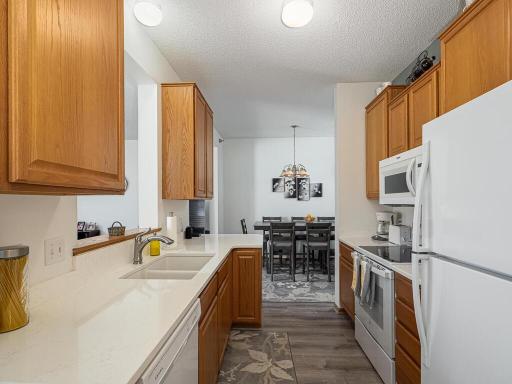 The kitchen features all new (2021) appliances (stove, microwave, refrigerator and dishwasher) PLUS beautiful new quartz countertops, sink and disposal in 2022.