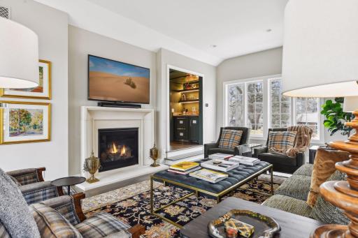 Family room offers an abundance of natural light with a gas fireplace.