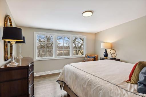 The view from this upper bedroom can see downtown Minneapolis skyscrapers at night, along with Minnehaha Creek and what the sellers call, "the back 40", meaning the unfenced natural marsh area.