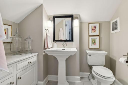 Ensuite Bath with heated floors, honed Carrara marble countertop and plenty of storage.