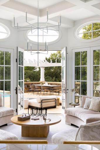 French doors lead to the pergola sitting area.