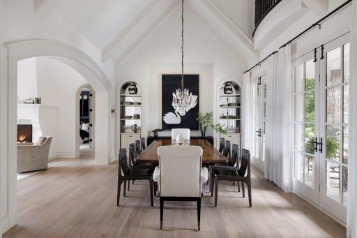 The dining room is spectacular and you will enjoy many dinners in this extraordinary and comfortable space. Two sets of French doors lead to a stone arched patio and the site line through the house is experiential.