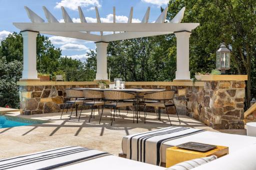 This pergola covered eating area offers infinite views of the Minnesota River Valley. Quiet and Serene. Imagine the Vineyards of California and that is what you will experience here.