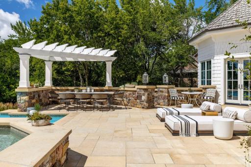 The combination of beautiful limestone and stone wall restoration are masterfully designed to create outdoor living areas.