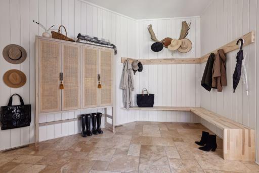 The mudroom space absolute feels like a Saint Kitts Inspired Mediterranean experience