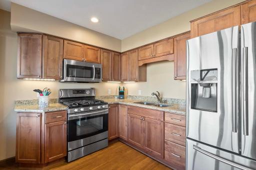 Beautiful Full kitchen is easy access from walk out lower level patio is great for in-law suite or an extra kitchen for entertaining. Full sized stainless steel appliances.