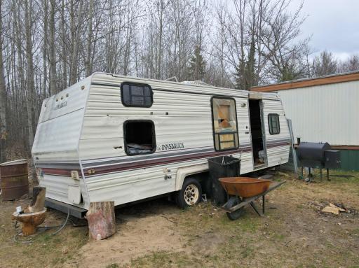 CAMPER CONVERTED TO WOOD SHED