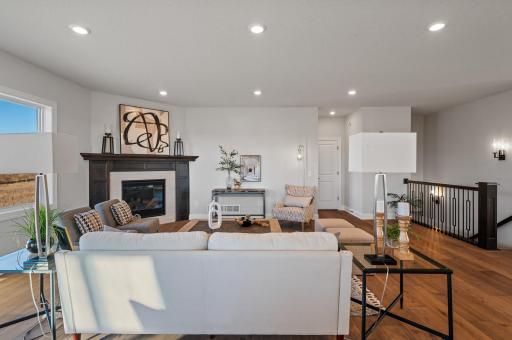 Living Room w/ Gas Fireplace featuring custom half-wall stone